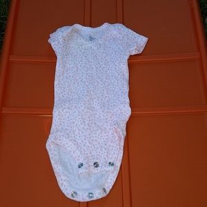 Precious Firsts size newborn onesie.